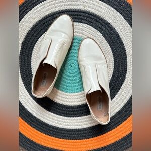 White patent vynl dress shoes. CAUTION: